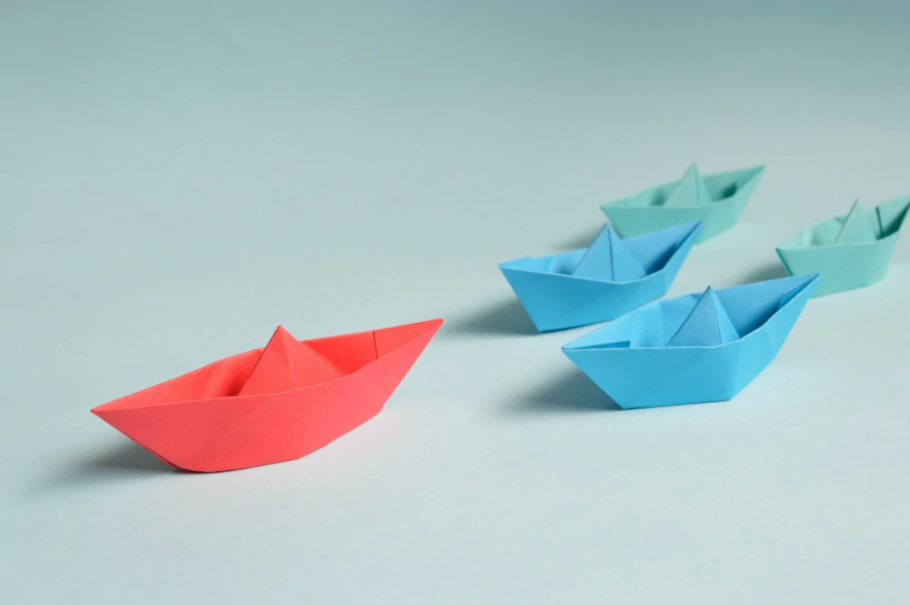 Paper boats on a table by Miguel Á. Padriñán from Pexels
